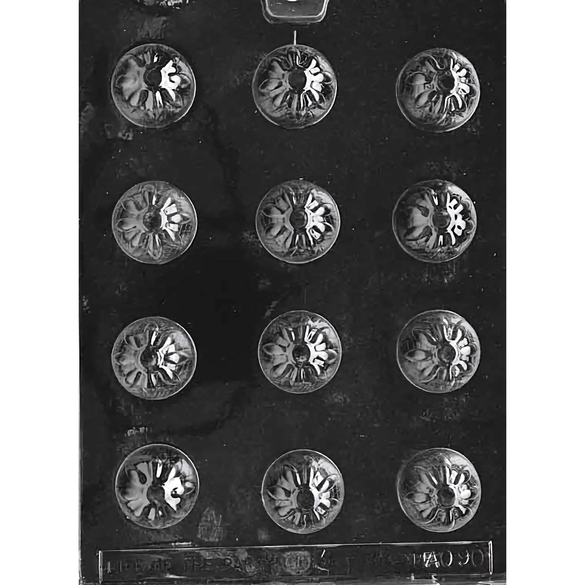 Star Bon-Bon Chocolate Mold with twelve round cavities, each featuring an intricate starburst design. The mold creates 1-3/8 inch diameter and 7/8 inch deep chocolate pieces, using approximately 0.5 ounces of chocolate per piece. Made of food-grade plastic and manufactured in the USA.