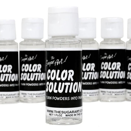 The Sugar Art Color Solution bottles lined up with front label showing; designed to mix with edible powders and luster dusts to create food-safe paint.