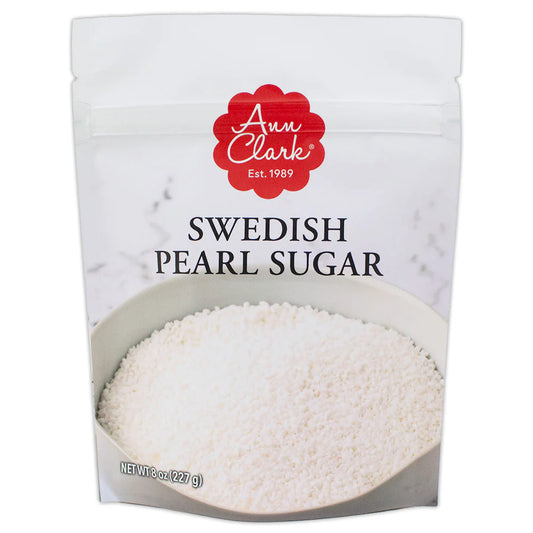 Front of Ann Clark Swedish Pearl Sugar package showing white compressed sugar pearls in a bowl against a marble background.