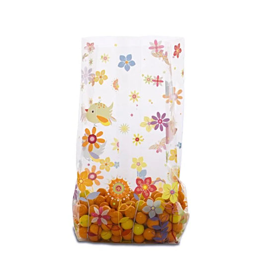 Clear gusseted cello bag with bright floral and bird design, filled with orange and yellow candy, perfect for spring packaging, party favors, or retail gifts.