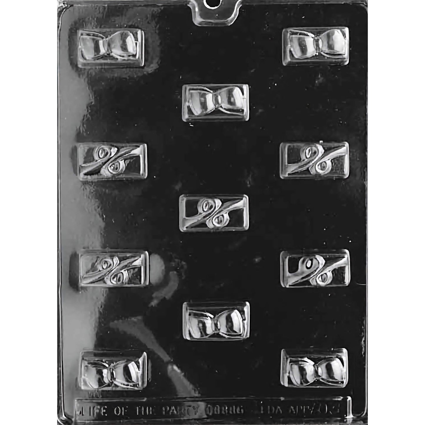 Chocolate mold with intricate swirls and bow designs, featuring 11 cavities for making elegant swirl and bow-themed chocolates.