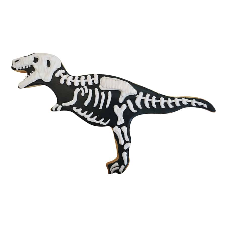 T-Rex skeleton cookie decorated with black icing and white icing bones for a fossil-inspired design.