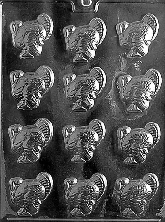 SMALL TURKEYS chocolate mold with cavities shaped like small turkeys; clear sheet.