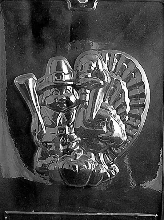PILGRIM & TURKEY chocolate mold with large cavity featuring pilgrim and turkey scene; clear sheet.