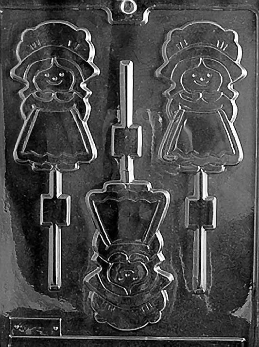 GIRL PILGRIM Lollipop chocolate mold with pilgrim girl lollipop cavities; clear sheet.
