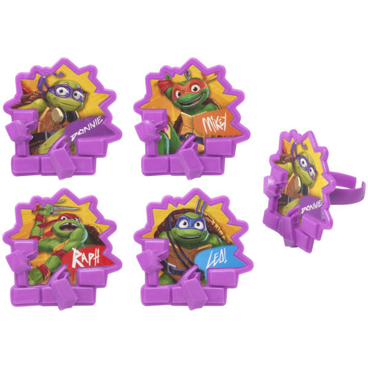 Set of four Teenage Mutant Ninja Turtles cupcake rings featuring Donnie, Mikey, Raph, and Leo with bright purple frames