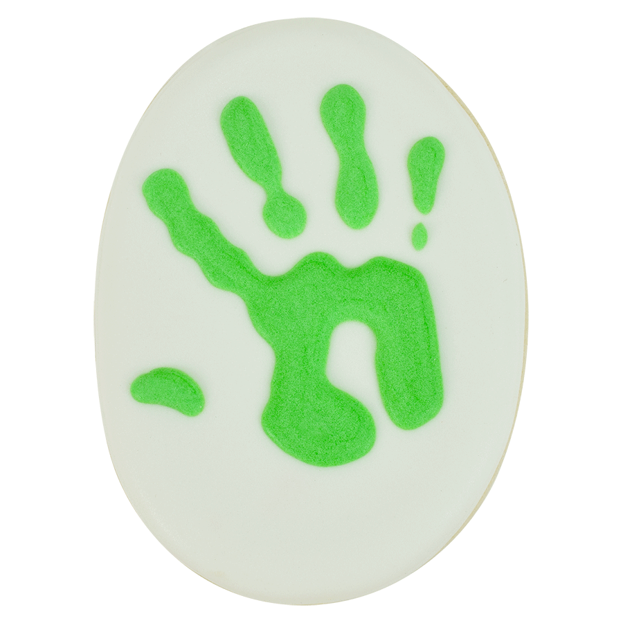 Decorated oval cookie with a green handprint design.