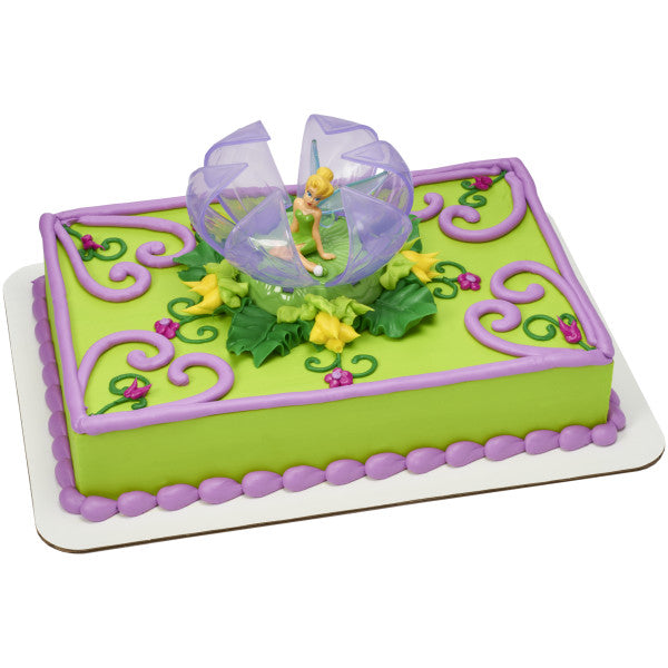 A rectangular cake decorated with the Tinker Bell DecoSet®, complete with green vines and floral accents.