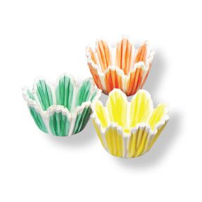 Three mini tulip baking cups in pastel green, yellow, and orange with white accents, each featuring fluted petal-like edges for a floral-inspired presentation.