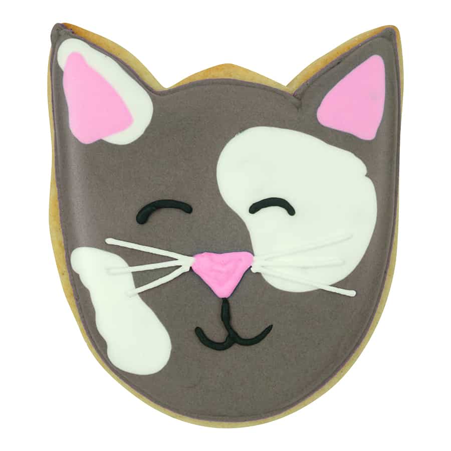 Cat-shaped cookie decorated with gray and white icing, pink nose, and whiskers, made using a tulip bloom cookie cutter.