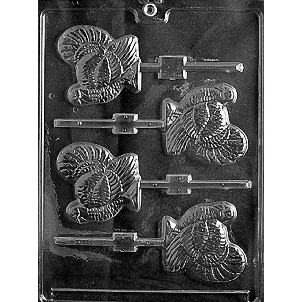Clear lollipop mold featuring four turkey shapes with layered feather detail and built-in stick channels, arranged vertically on a glossy plastic sheet.