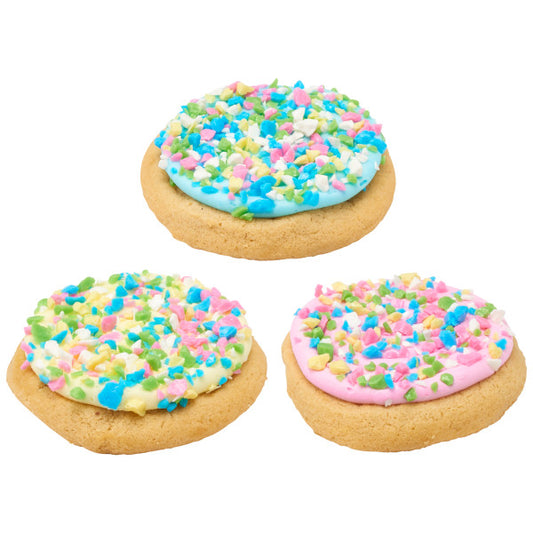 Sugar cookies topped with pastel frosting and sprinkled with tutti frutti flavored candy shards for decoration.