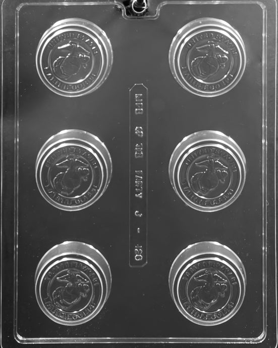 Clear six-cavity cookie-style chocolate mold featuring the United States Marine Corps emblem in each round cavity; raised coin design for patriotic chocolates.