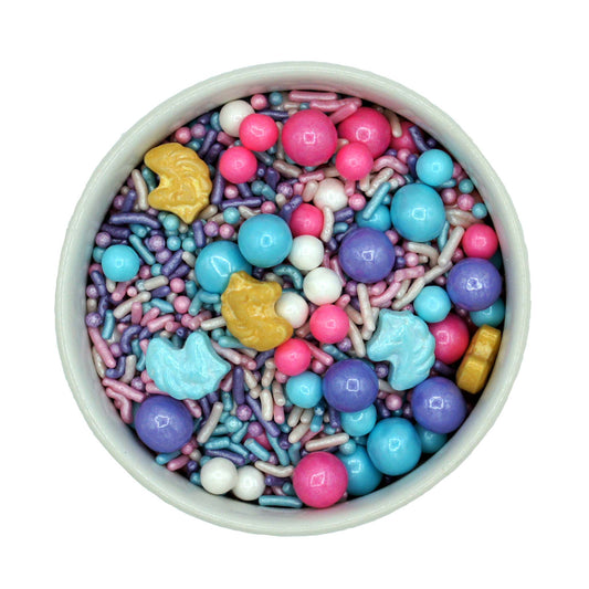 A whimsical sprinkle mix with pastel pink, purple, blue, and gold jimmies, Sixlets, sugar pearls, and sweet tart-like unicorn-shaped candies, perfect for magical dessert decorations.