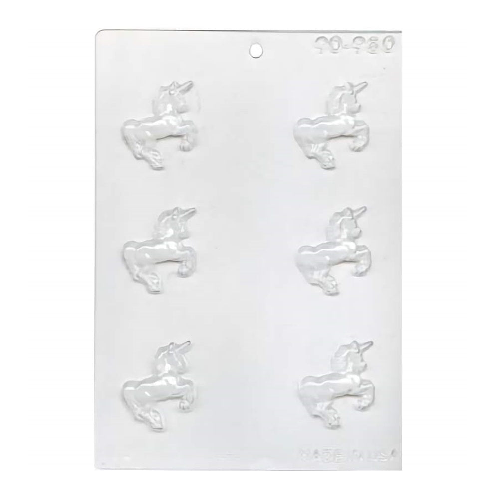 A clear plastic chocolate mold for creating six unicorn-shaped candies, featuring raised designs for added detail. Each unicorn is in a resting position with its head turned to the side, showcasing a flowing mane and tail, and a prominent, spiraled horn.