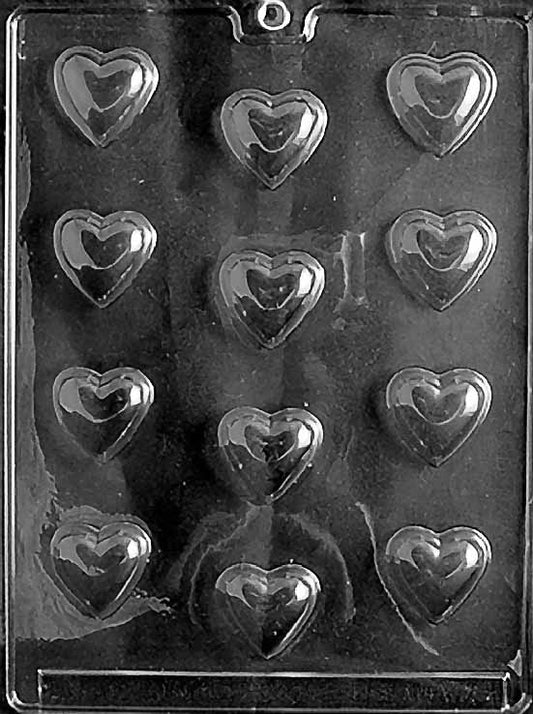 SMALL HEARTS chocolate mold featuring small rounded heart cavities; smooth surfaces on clear mold sheet.