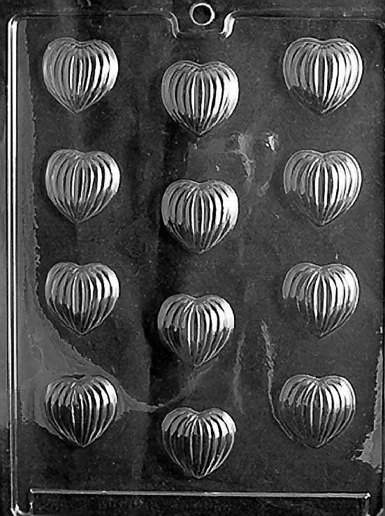 GROOVED HEARTS chocolate mold with cavities shaped like hearts featuring groove texture; clear mold.