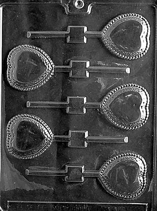 LACE HEART Lollipop chocolate mold with lollipop cavities shaped like lace-detailed hearts; clear mold.