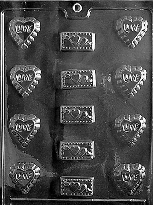 LOVE ASSORTMENT chocolate mold with multiple small romantic-shaped cavities; clear mold.