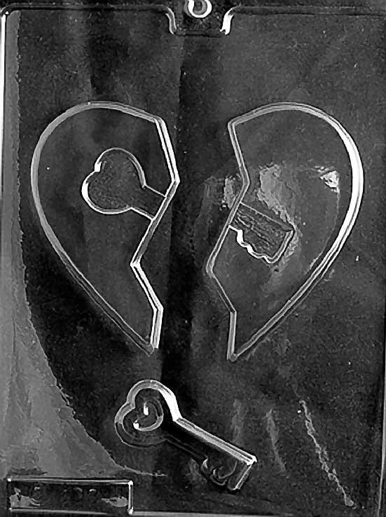 HEART WITH KEY chocolate mold with large heart cavity accented by key design; clear sheet.