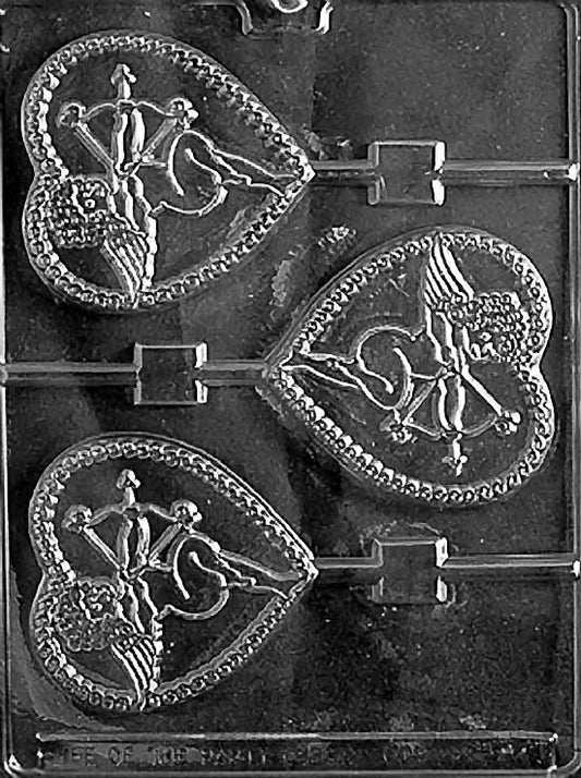 CUPID IN HEART Lollipop chocolate mold with lollipop cavities showing Cupid inside heart; clear mold.