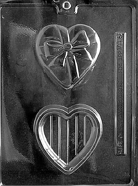 HEART POUR BOX WITH BOW chocolate mold with heart-shaped pour box cavities topped by bows; clear mold.