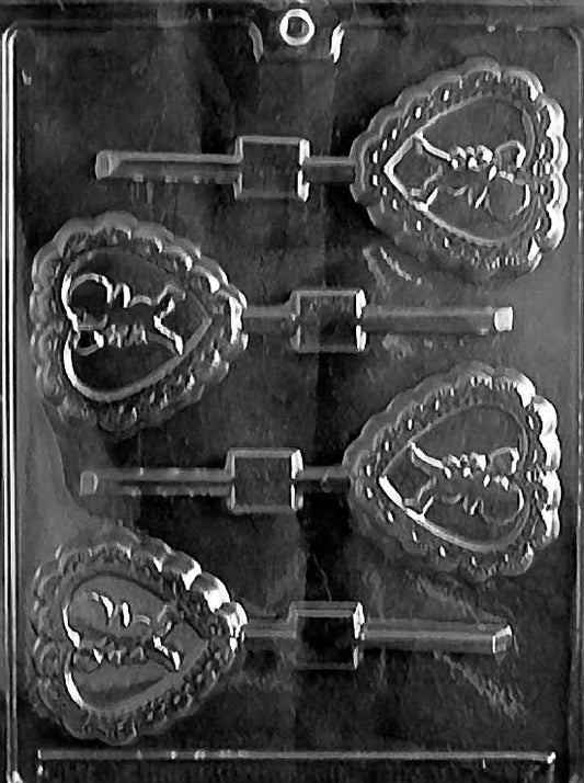 CUPID IN HEART Lollipop chocolate mold with lollipop cavities showing Cupid inside hearts; clear mold.