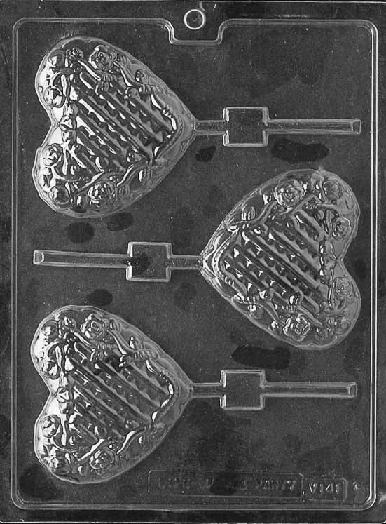 LATTICE HEART WITH FLOWERS Lollipop chocolate mold with floral lattice heart lollipop cavities; clear mold.