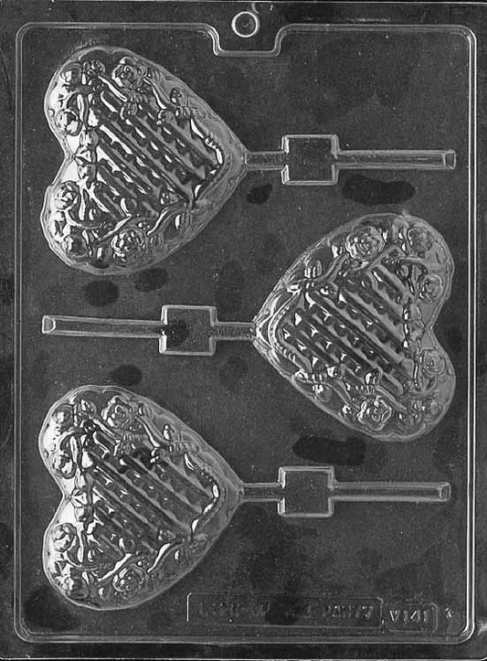 LATTICE HEART WITH FLOWERS Lollipop chocolate mold with floral lattice heart lollipop cavities; clear mold.