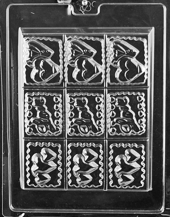 TRAY MOLD LOVE DESIGNS chocolate mold with multiple cavities featuring assorted love designs; clear sheet.