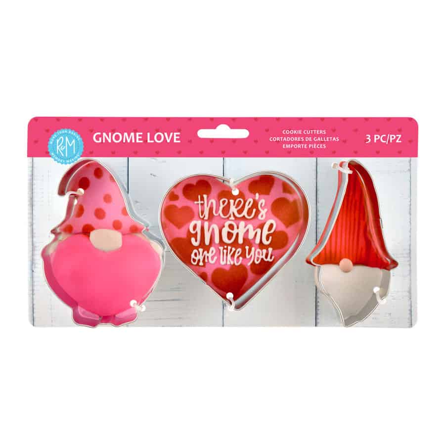 Valentine-themed cookie cutter set in packaging, featuring a heart cutter and two gnome-shaped cutters with a pink background.