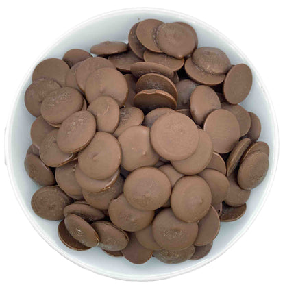 Top-down, detailed view showcasing the smooth texture and rich brown color of premium vegan and dairy free dark chocolate candy melts.