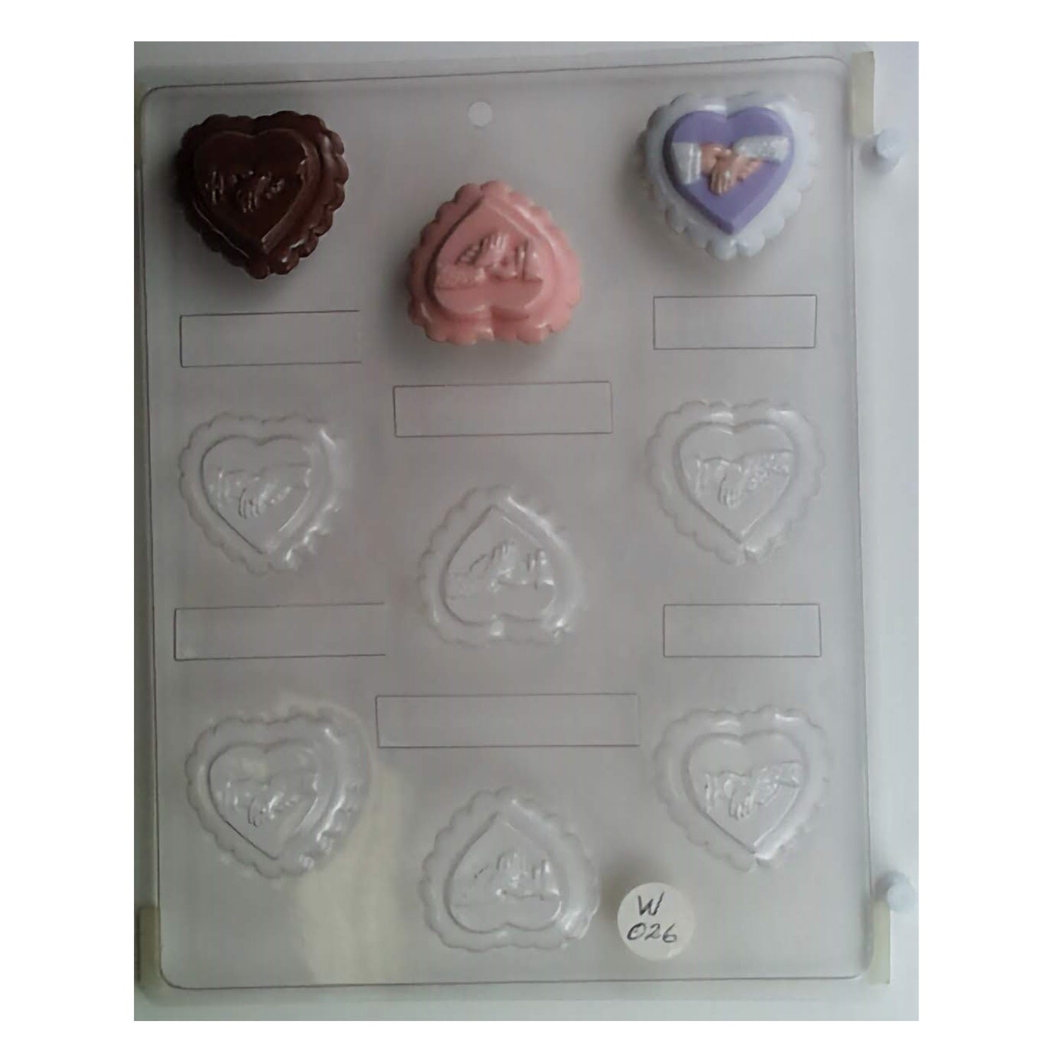 This chocolate mold captures the romantic essence of a wedding with its heart shape formed by two hands, symbolizing unity and love, ideal for wedding receptions or engagement party chocolates.