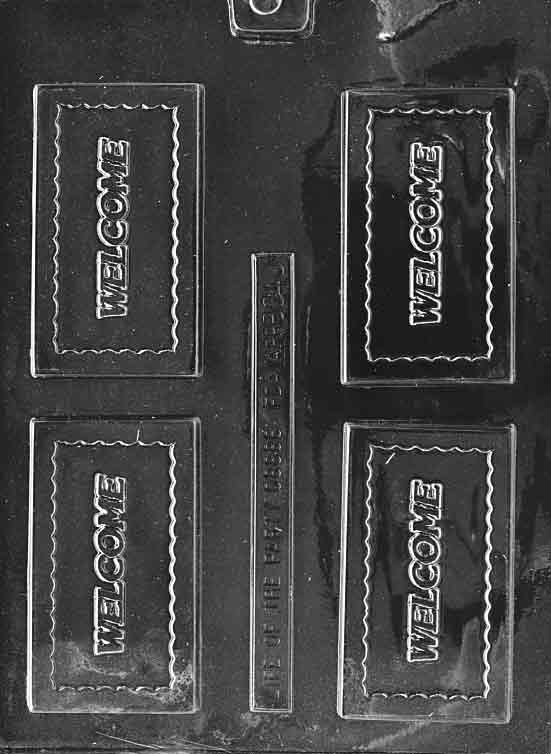 Clear chocolate mold with four rectangular cavities, each featuring a scalloped border and the raised word “WELCOME,” arranged on a glossy plastic sheet.