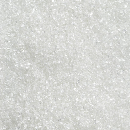 Close-up of white sanding sugar showing coarse, translucent sugar crystals with a clear, sparkling finish.