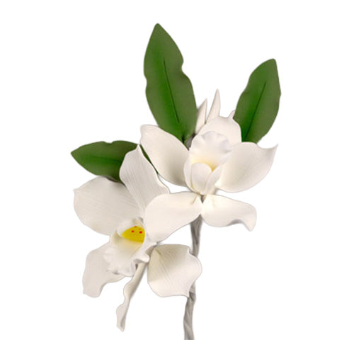 White gum paste cymbidium orchid spray with yellow centers and green leaves, measuring 9.5 by 4.5 inches, for cake decorating.
