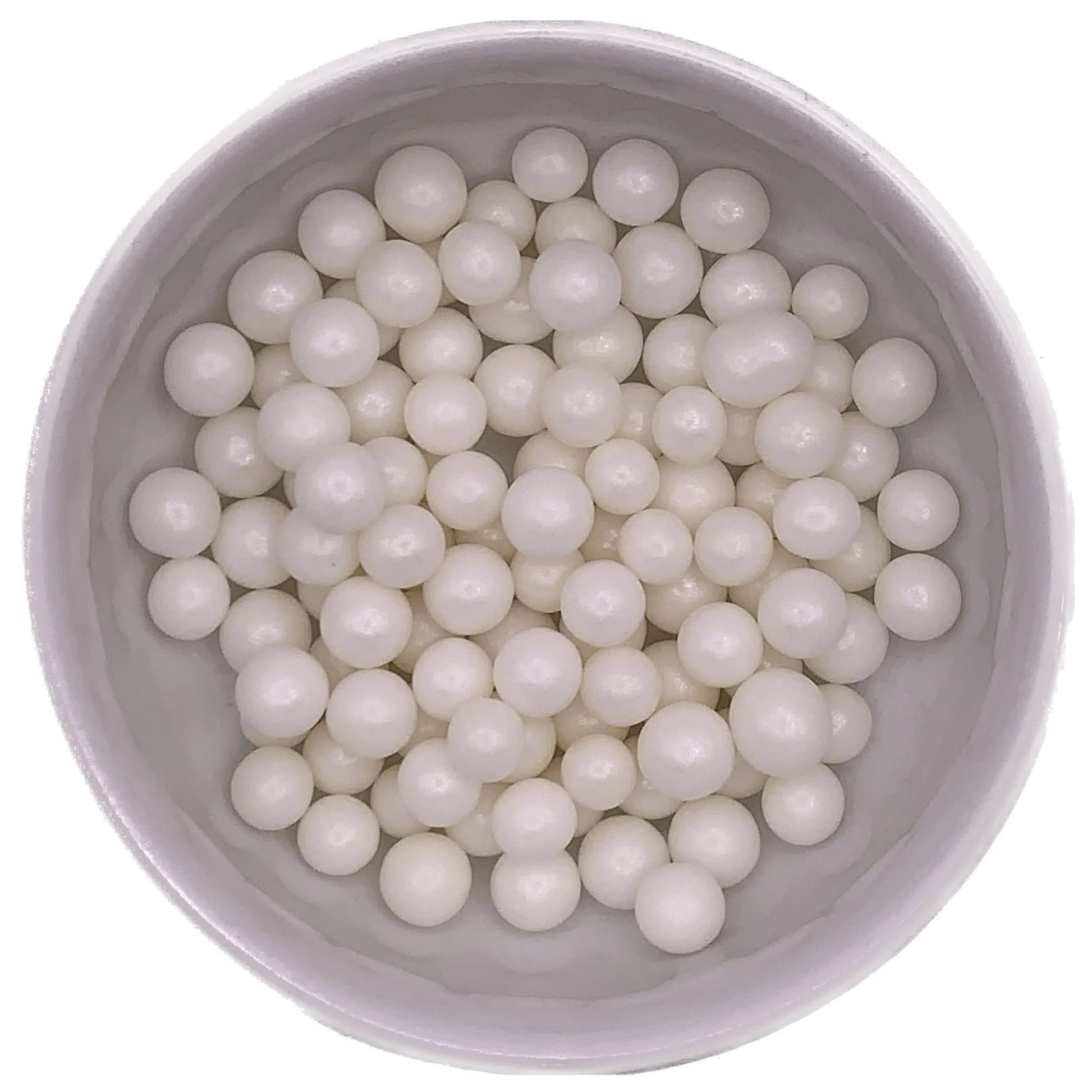 Close-up of edible white pearlized dragees, 8mm in size, displayed in a bowl for cake and dessert decoration.
