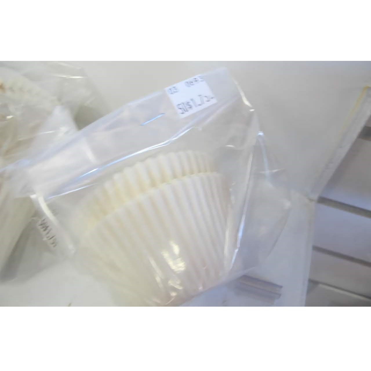 A package of white jumbo baking cups