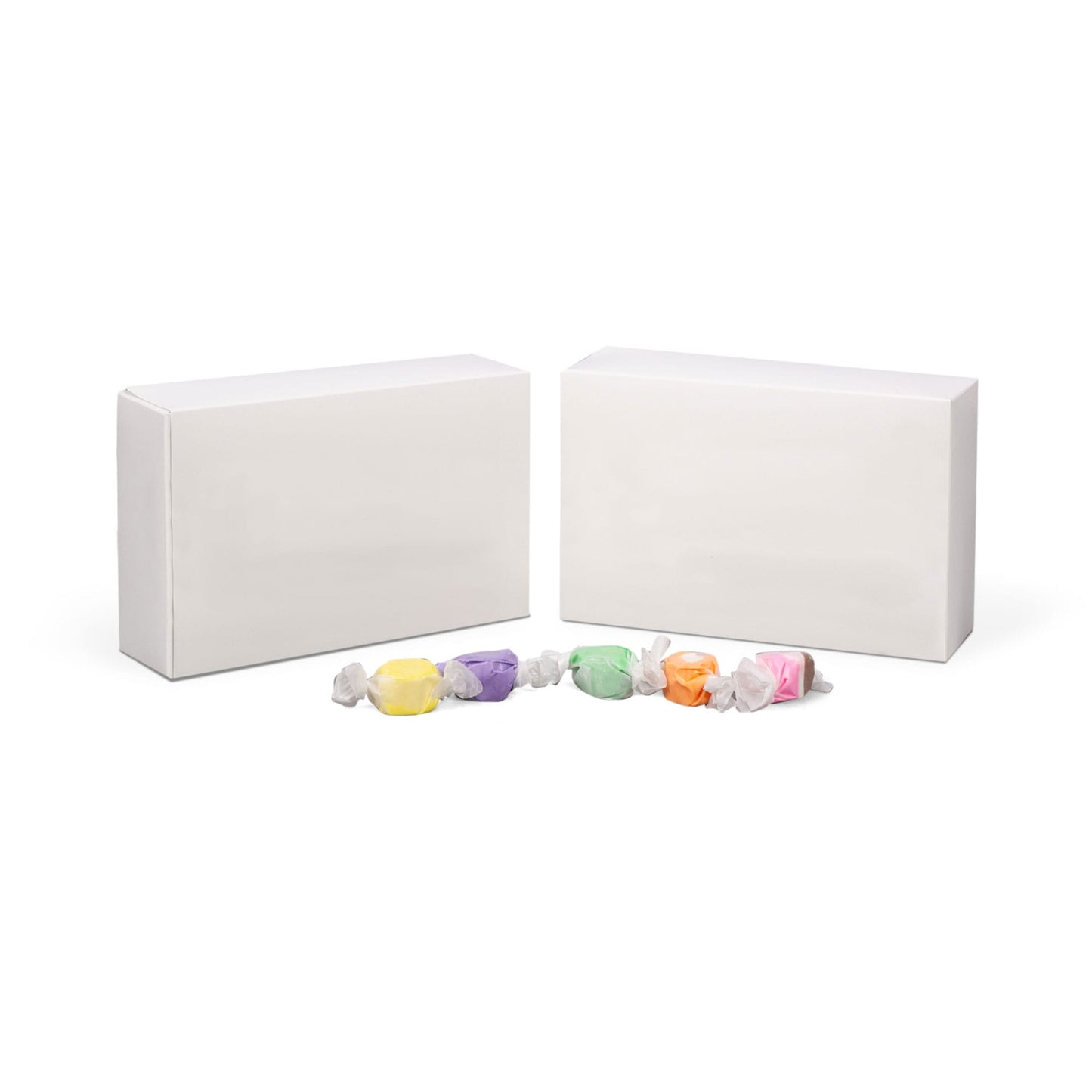 White 1 1/2 lb candy box with assorted wrapped candies, perfect for packaging and displaying chocolates or confections.