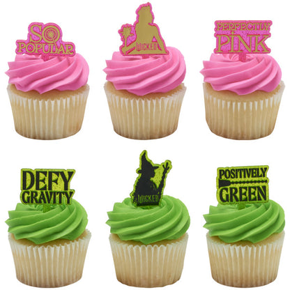 Six frosted cupcakes—three with pink icing, three with green—each topped with a different Wicked pick, showing the phrases and character silhouettes in matching colors.
