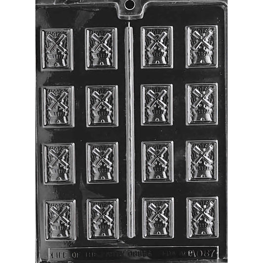 Windmill Mints Chocolate Mold with twelve cavities, each featuring a detailed windmill shape. The mold creates 1-3/16 inch by 1-9/16 inch chocolate pieces, using approximately 0.1 ounces of chocolate per piece. Made of food-grade plastic and manufactured in the USA.