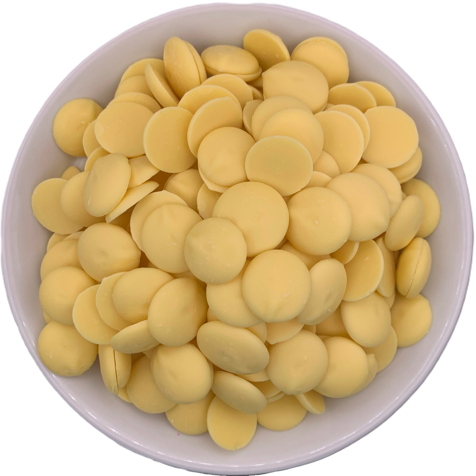 Directly above view of a white bowl filled with Merckens yellow chocolate melting wafers, emphasizing the light yellow color for a cheerful addition to baking creations.