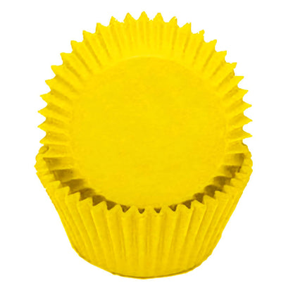 Yellow standard greaseproof cupcake liners in a stack, showcasing their bright, sunny yellow color, ideal for cheerful and summery dessert presentations.