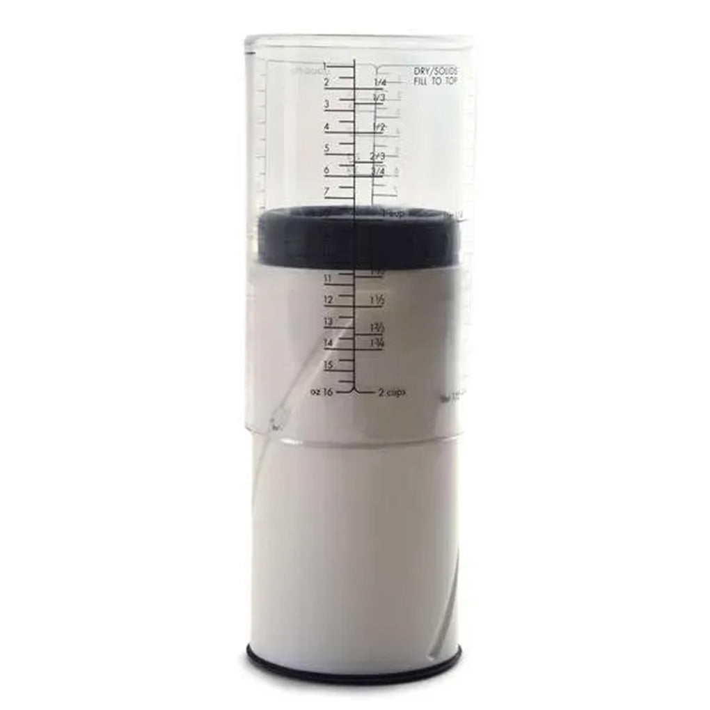 Adjustable measuring cup assembled with the clear measurement sleeve extended above the white plunger and black adjustment ring.