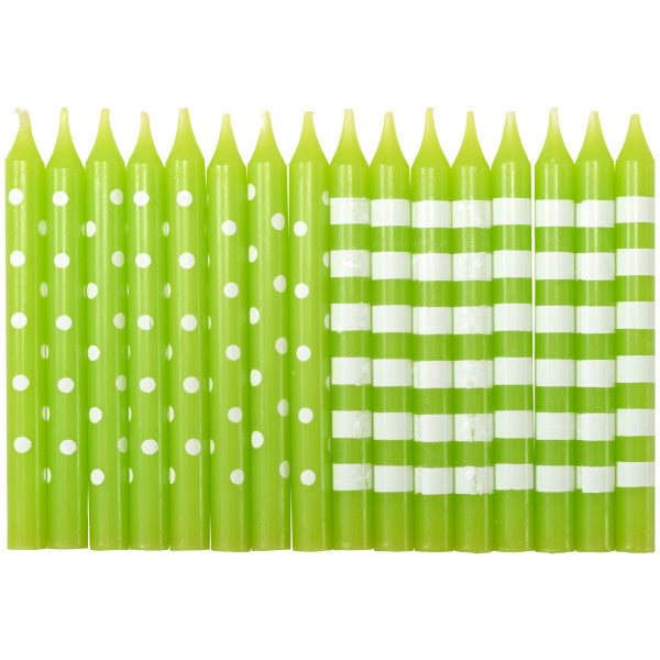 Green birthday candles with polka dot and striped patterns.