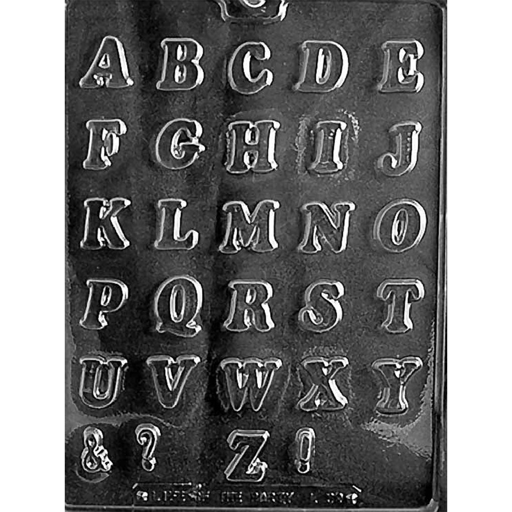 Clear Letters A-Z Small Chocolate Mold photographed against a black background with 29 cavities including the complete alphabet plus ampersand, question mark, and exclamation point.
