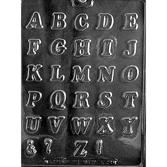 Clear Letters A-Z Small Chocolate Mold photographed against a black background with 29 cavities including the complete alphabet plus ampersand, question mark, and exclamation point.