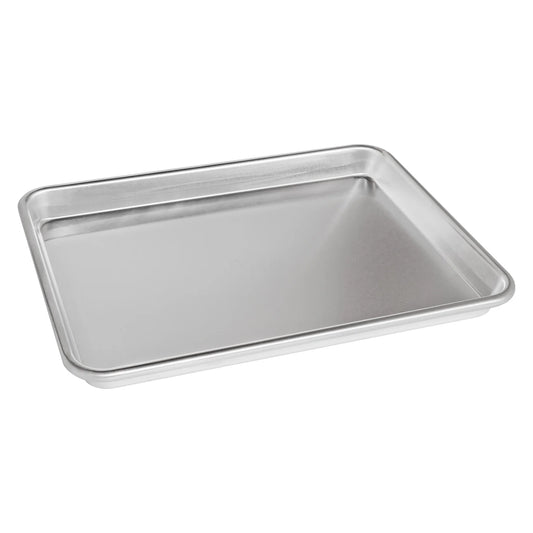Angled view of aluminum quarter sheet pan with raised edges, ideal for baking and roasting