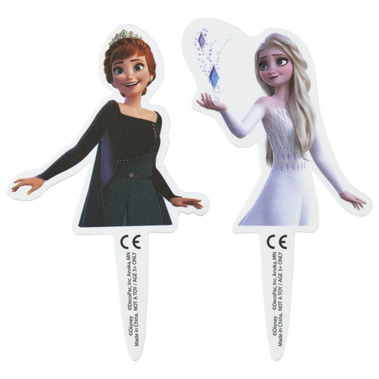 Two Frozen cupcake topper picks on a white background, showing Anna in a dark outfit with a tiara and Elsa in a pale dress with long blonde hair and snowflake sparkle accents.