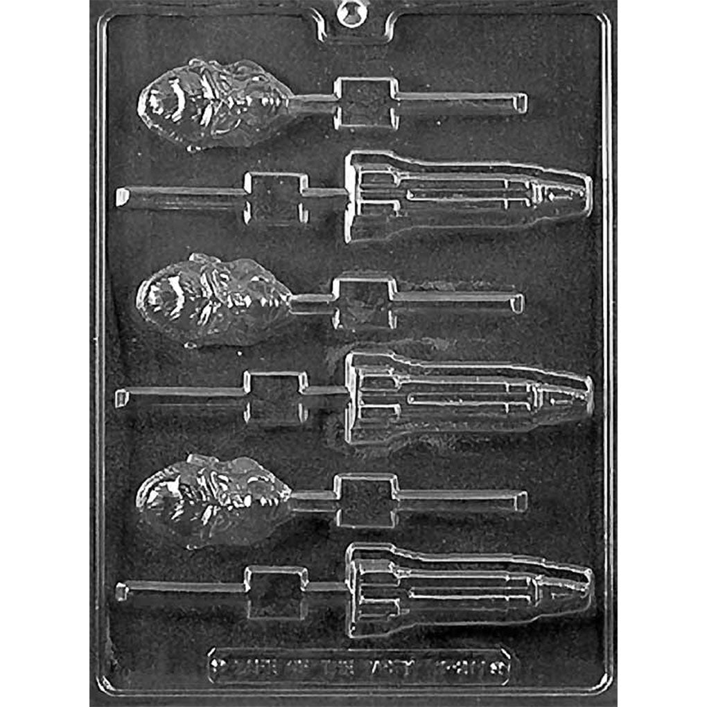 Clear Ape & Empire State Building Lollipop Chocolate Mold photographed against a black background with 6 cavities featuring 3 detailed ape heads and 3 Empire State Building-shaped chocolate pops.